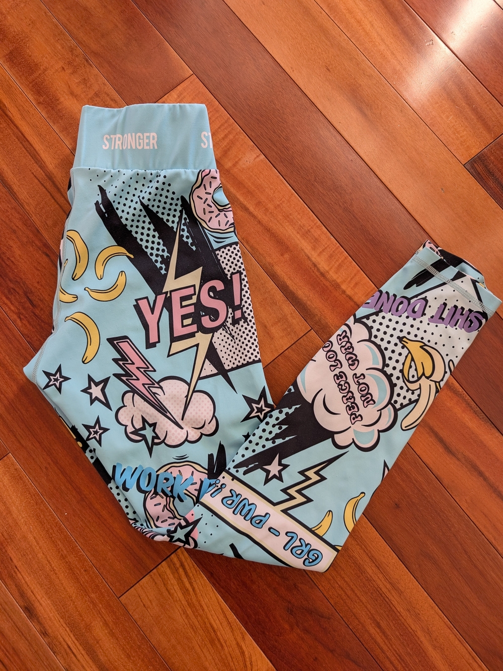 Stronger Light Blue Graphic Leggings with Fun Pop-Art Print